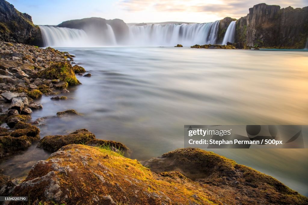 Landscape of waterfall at sunset