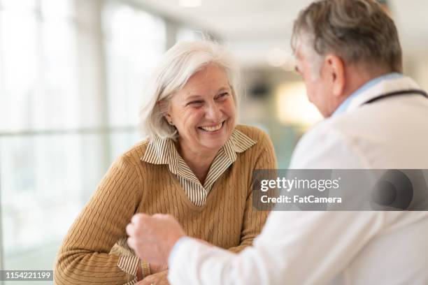senior female patient at medical consultation - diabetes care stock pictures, royalty-free photos & images