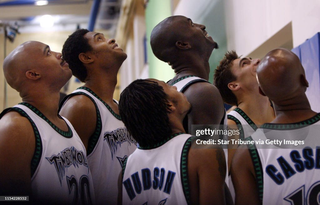 Timberwolves Members Members of the Minnesota Timberwolves look upward to pose for a... News ...