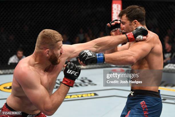 Jan Blachowicz of Poland punches Luke Rockhold in their light heavyweight fight during the UFC 239 event at T-Mobile Arena on July 6, 2019 in Las...