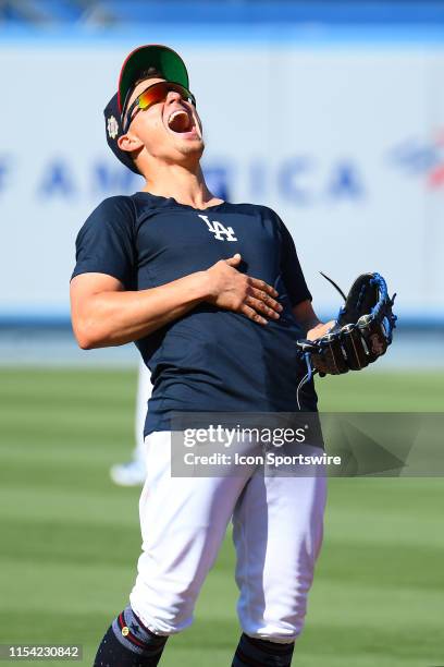 Los Angeles Dodgers infielder Kike Hernandez laughs during batting practice before a MLB game between the San Diego Padres and the Los Angeles...