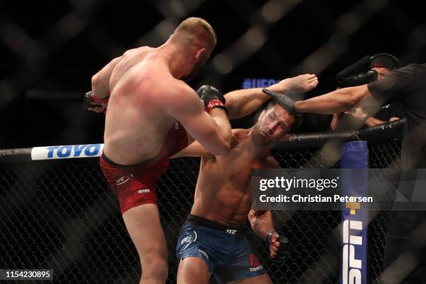 Jan Blachowicz of Poland kicks Luke Rockhold in their light heavyweight fight during the UFC 239 event at T-Mobile Arena on July 6, 2019 in Las...