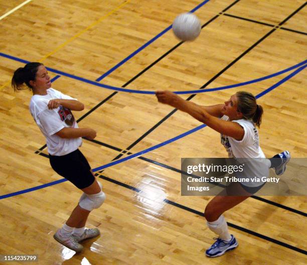 Junior Megan Norling, right, one of four of last year's varsity players returning to the Armstrong High School girl's volleyball team this year, and...