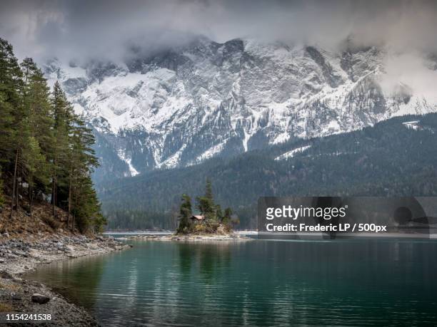 alone in the middle of eibsee, germany - lake zurich stock pictures, royalty-free photos & images