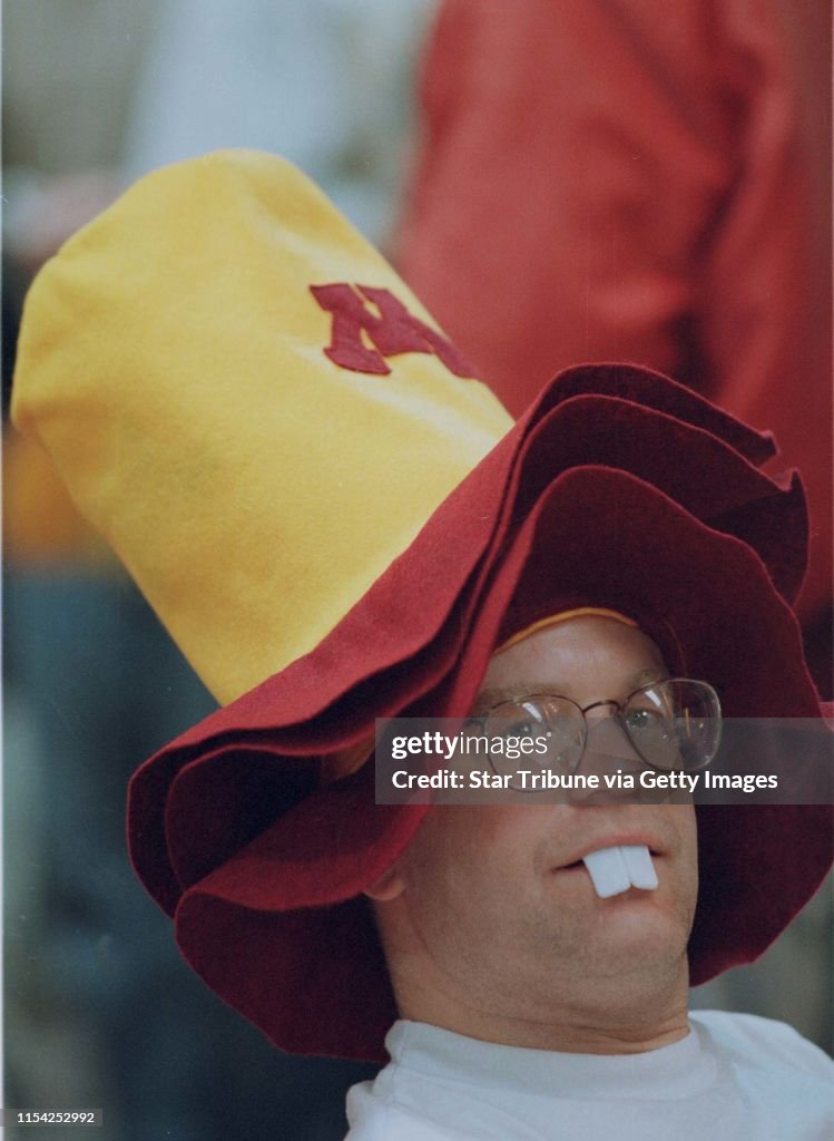 Jim Huninghake of west St. Paul with buck teeth and all  takes a break from cheering during a Pregame prep rally at Union Center.(Photo by JERRY HOLT/Star Tribune via Getty Images)