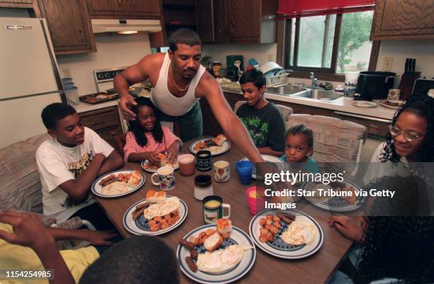 Single father of five David Calaway. -- David Calaway serves breakfast to his five kids and three nephews ; his son 13-year-old Jermaine Johnson, his...