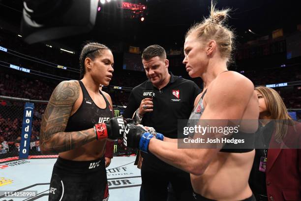 Amanda Nunes of Brazil and Holly Holm touch gloves in their UFC bantamweight championship fight during the UFC 239 event at T-Mobile Arena on July 6,...