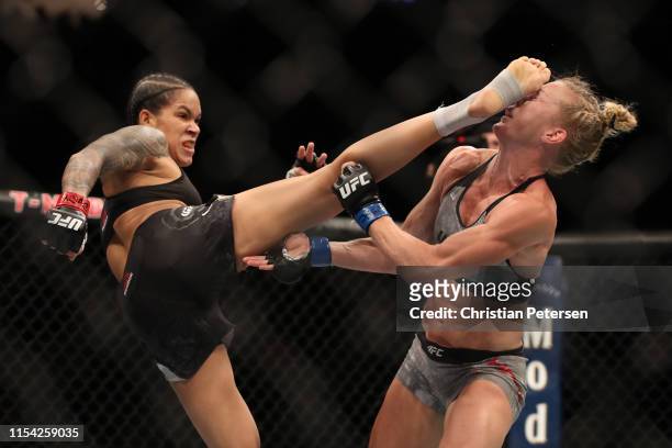 Amanda Nunes of Brazil kicks Holly Holm in their UFC bantamweight championship fight during the UFC 239 event at T-Mobile Arena on July 6, 2019 in...