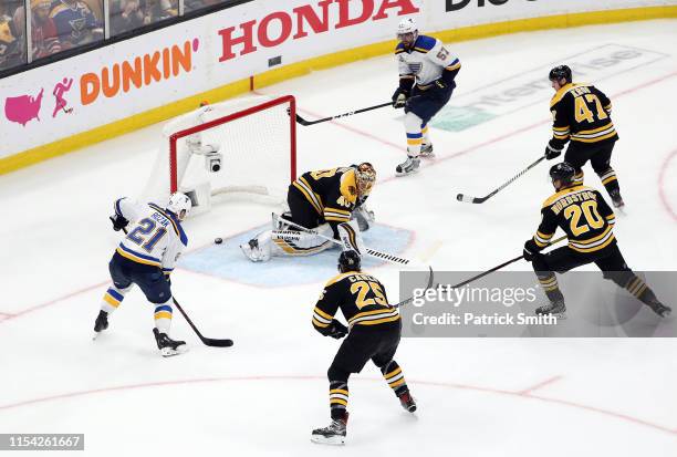 David Perron of the St. Louis Blues scores a third period goal against Tuukka Rask of the Boston Bruins in Game Five of the 2019 NHL Stanley Cup...