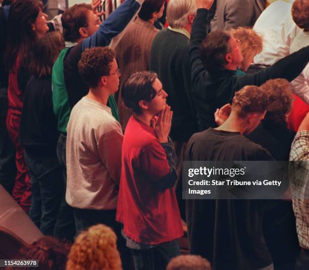 Pentecostal revival at the Brownsville Assembly of God. Matt Johnson of St. Cloud puts his hands together in prayer at Brownsville Assembly of God.