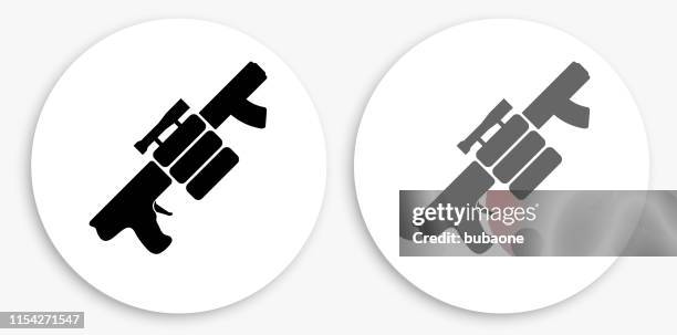 air gun and spare bullets black and white round icon - paintball stock illustrations