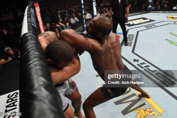 Jon Jones elbows Thiago Santos of Brazil in their UFC light heavyweight championship fight during the UFC 239 event at T-Mobile Arena on July 6, 2019...