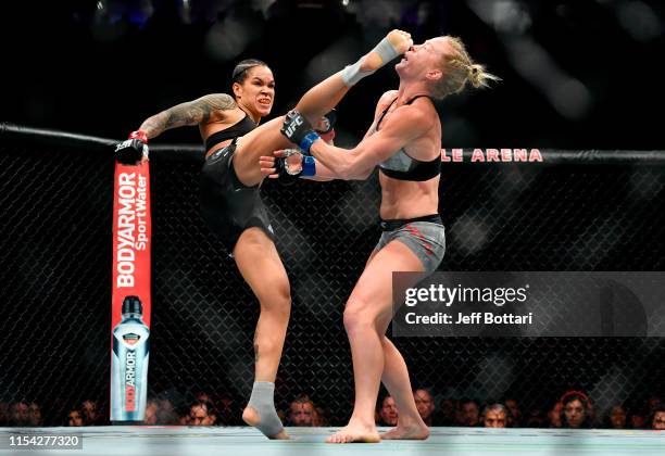 Amanda Nunes of Brazil kicks Holly Holm in the head in their UFC bantamweight championship fight during the UFC 239 event at T-Mobile Arena on July 7...