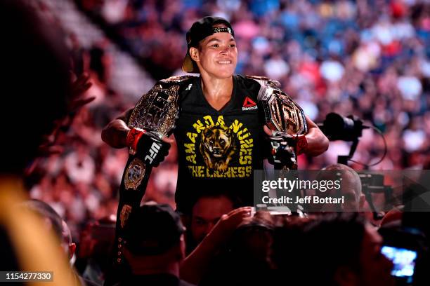 Amanda Nunes of Brazil celebrates after defeating Holly Holm in their UFC bantamweight championship fight during the UFC 239 event at T-Mobile Arena...