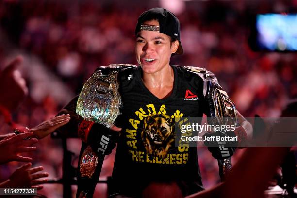 Amanda Nunes of Brazil celebrates after defeating Holly Holm in their UFC bantamweight championship fight during the UFC 239 event at T-Mobile Arena...