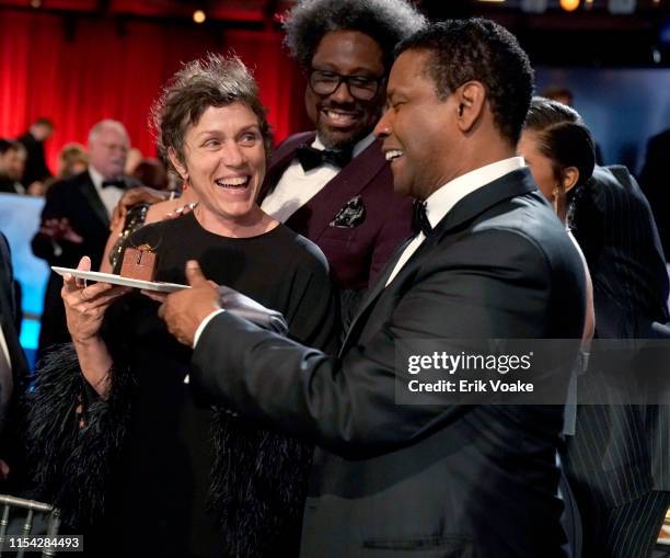 Frances McDormand, W. Kamau Bell, and Denzel Washington attend the 47th AFI Life Achievement Award honoring Denzel Washington at Dolby Theatre on...