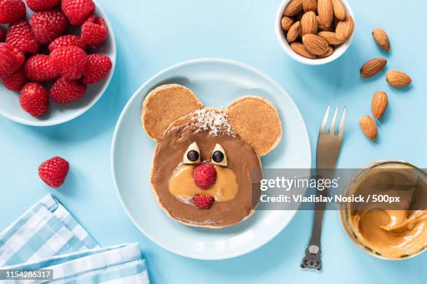cute funny pancake food art for kids - blue bear stock-fotos und bilder