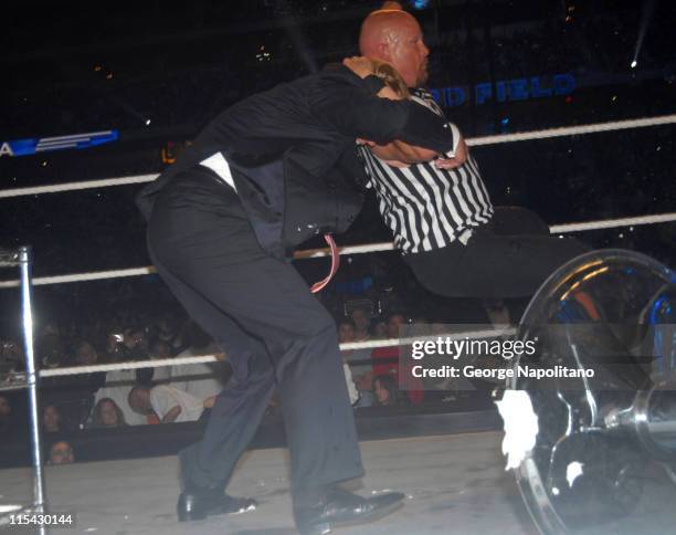 Steve austin catches Donald Trump in his Stone Cold Stunner after they celebrated Vince McHaon's head getting shaved at Wrestlemania 23 in Detroit.