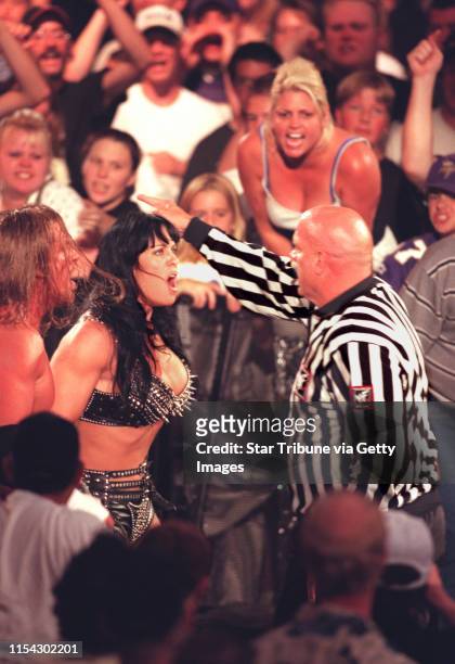 Summerslam wrestling with Gov. Ventura -- Gov. Ventura turned referee chases Chyna the wrestler down and ramp to throw her out of the ring as...