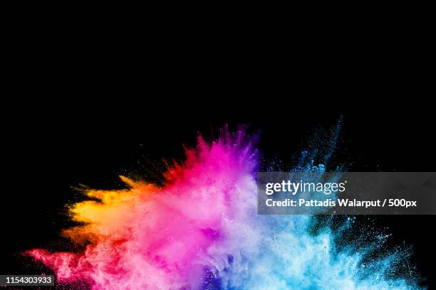 launched colorful powder on black backgroundcolor powder explosioncolorful dust splashing - sprengkörper stock-fotos und bilder
