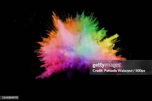 launched colorful powder on black backgroundcolor powder explosioncolorful dust splashing - colour smoke ストックフォトと画像