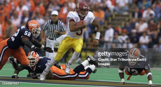 -- Champaign Il, Gophers at Illinois 10/16/99----Gopher quaterback Billy Cockerham picks up a first down in the 2nd quarter as he leaves the Illnois...