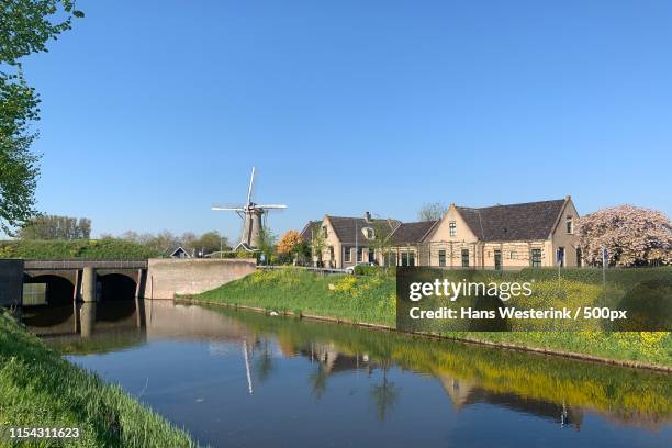 hoofdvaart and windmill the firstborn, hoofddorp, the netherlands - hoofddorp stock pictures, royalty-free photos & images