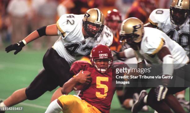 Minneapolis - Gophers vs. Purdue football -- Gophers quarterback Billy Cockerham is smothered by the Purdue defense in second-half action.
