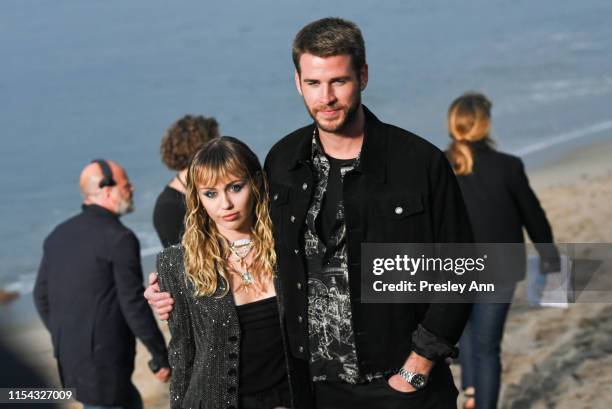 Miley Cyrus and Liam Hemsworth at Saint Laurent mens spring summer 20 show on June 06, 2019 in Malibu, California.