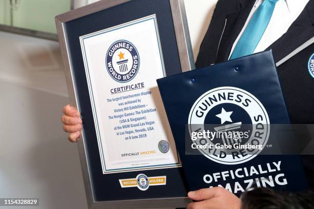 Guinness World Record certificate held by Michael Empric during The Hunger Games: The Exhibition grand opening at MGM Grand Hotel & Casino on June...