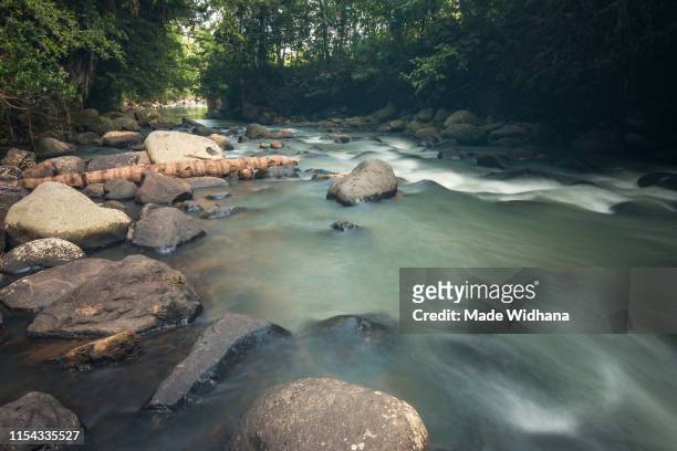 river water slow motion flow - made widhana stock pictures, royalty-free photos & images