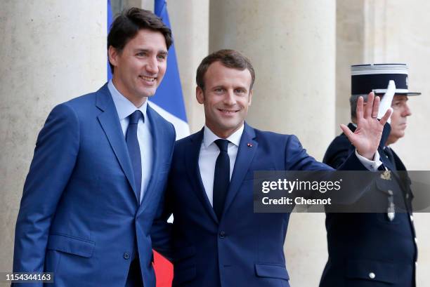 French President Emmanuel Macron welcomes Canadian Prime Minister Justin Trudeau prior their meeting at the Elysee Palace on June 07, 2019 in Paris,...