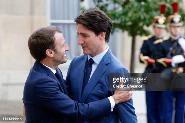 French President Emmanuel Macron welcomes Canadian Prime Minister Justin Trudeau prior their meeting at the Elysee Palace on June 07, 2019 in Paris,...