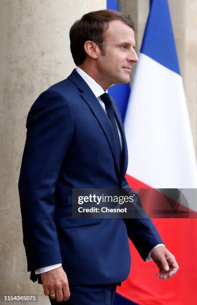 French President Emmanuel Macron waits for Canadian Prime Minister Justin Trudeau prior to their meeting at the Elysee Palace on June 07, 2019 in...