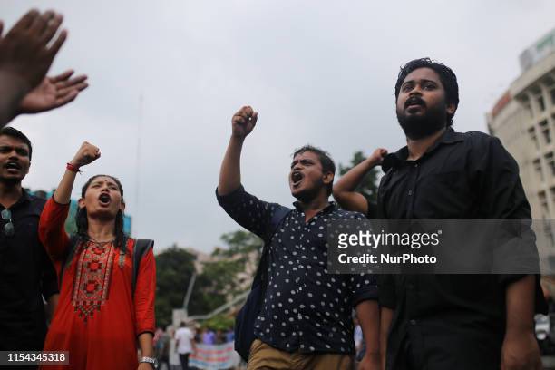 Supporters of Left Democratic Alliance shout slogans during a half-day strike across the country protesting the recent gas price hike in Dhaka,...