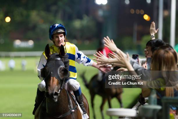 Jockey Chad Schofield riding Smart Patch wins the Race 5 The Cricket Club Valley Stakes at Happy Valley Racecourse on June 5, 2019 in Hong Kong.