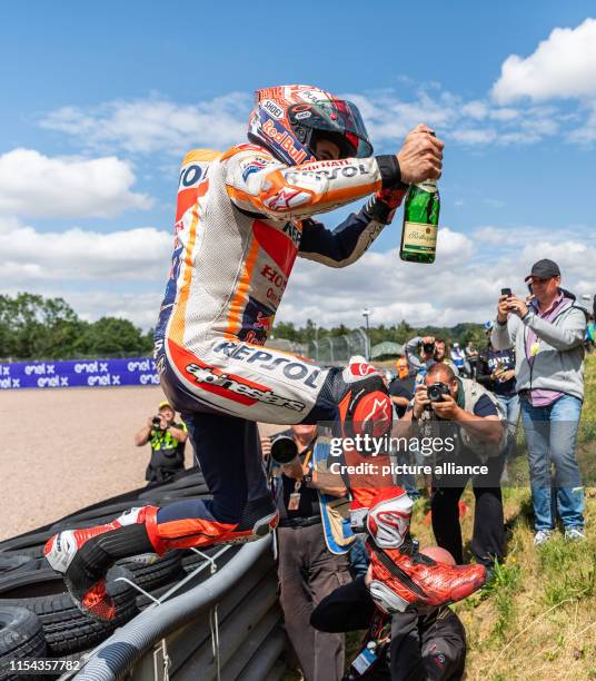 July 2019, Saxony, Hohenstein-Ernstthal: Motorsport/motorbike, Grand Prix of Germany, MotoGP race at the Sachsenring: Driver Marc Marquez jumps over...