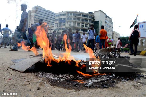 Activist of Left Democratic Alliance set fire as they block road during a half-day strike across the country protesting against natural gas price...