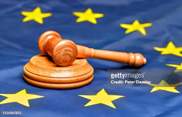 eu flag with gavel - unión europea fotografías e imágenes de stock