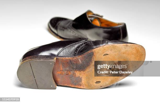 mens black shoes with hole in sole - schuhsohle stock-fotos und bilder