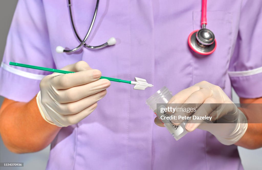 Nurse/doctor doing Smear Test