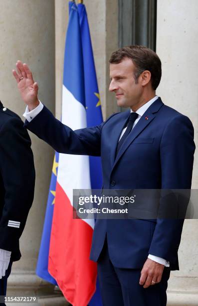 French President Emmanuel Macron gestures as Canadian Prime Minister Justin Trudeau leaves the Elysee Palace after their meeting on June 07, 2019 in...