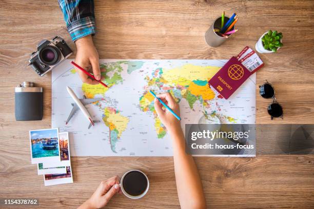 couple planning a travel - vacation planning stock pictures, royalty-free photos & images