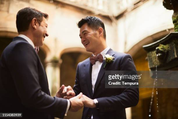 gay couple engagement portraits. - gay marriage stock pictures, royalty-free photos & images