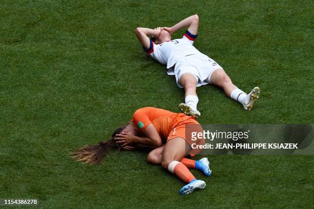 United States' defender Kelley O'Hara and United States' defender Ali Krieger after a clash of heads during the France 2019 Womens World Cup football...