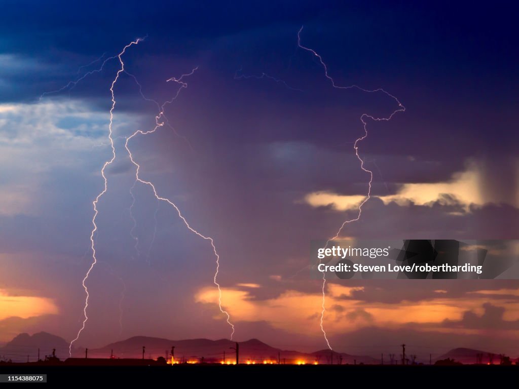 Three bolts of lightning striking near the Palo Verde Nuclear Station in Wintersburg Arizona during the 2012 Monsoon season, Arizona, United States of America, North America