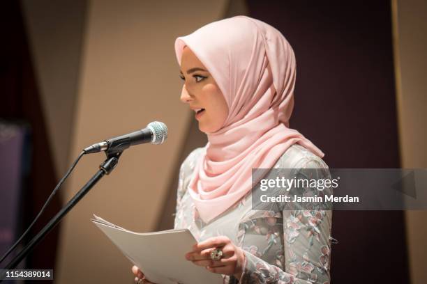 muslim woman delivering a speech - woman speech stock pictures, royalty-free photos & images