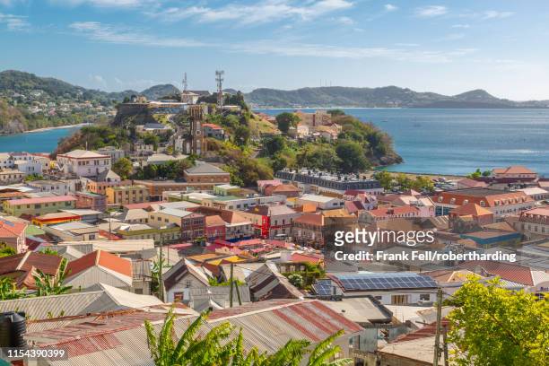 view of st. georges town and caribbean sea, st. george's, grenada, windward islands, west indies, caribbean, central america - insel grenada stock-fotos und bilder