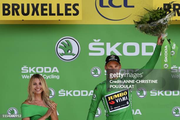 Dutch rider Mike Teunissen celebrates his best sprinter's green jersey on the podium of the second stage of the 106th edition of the Tour de France...