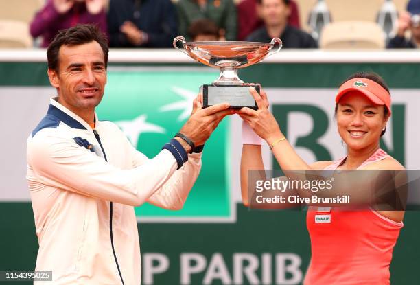 Latisha Chan of Taipei and Ivan Dodig of Croatia celebrate victory with the trophy following the mixed doubles final against Gabriela Dabrowski of...